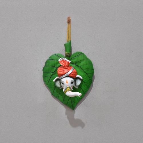 Lord Ganesha In Feta On Green Leaf Wall Hanging