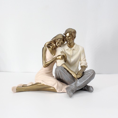 Romantic Couple Sitting Together And Holding Umbrella Statue Showpiece