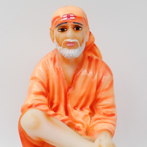 Sai Baba Sitting On Stone Statue Fiber Statue, Orange Sai baba, Medium Size 6 Inch